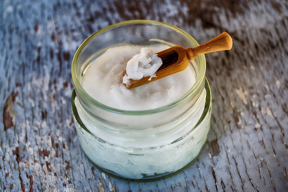 Coconut oil on a wooden spoon
